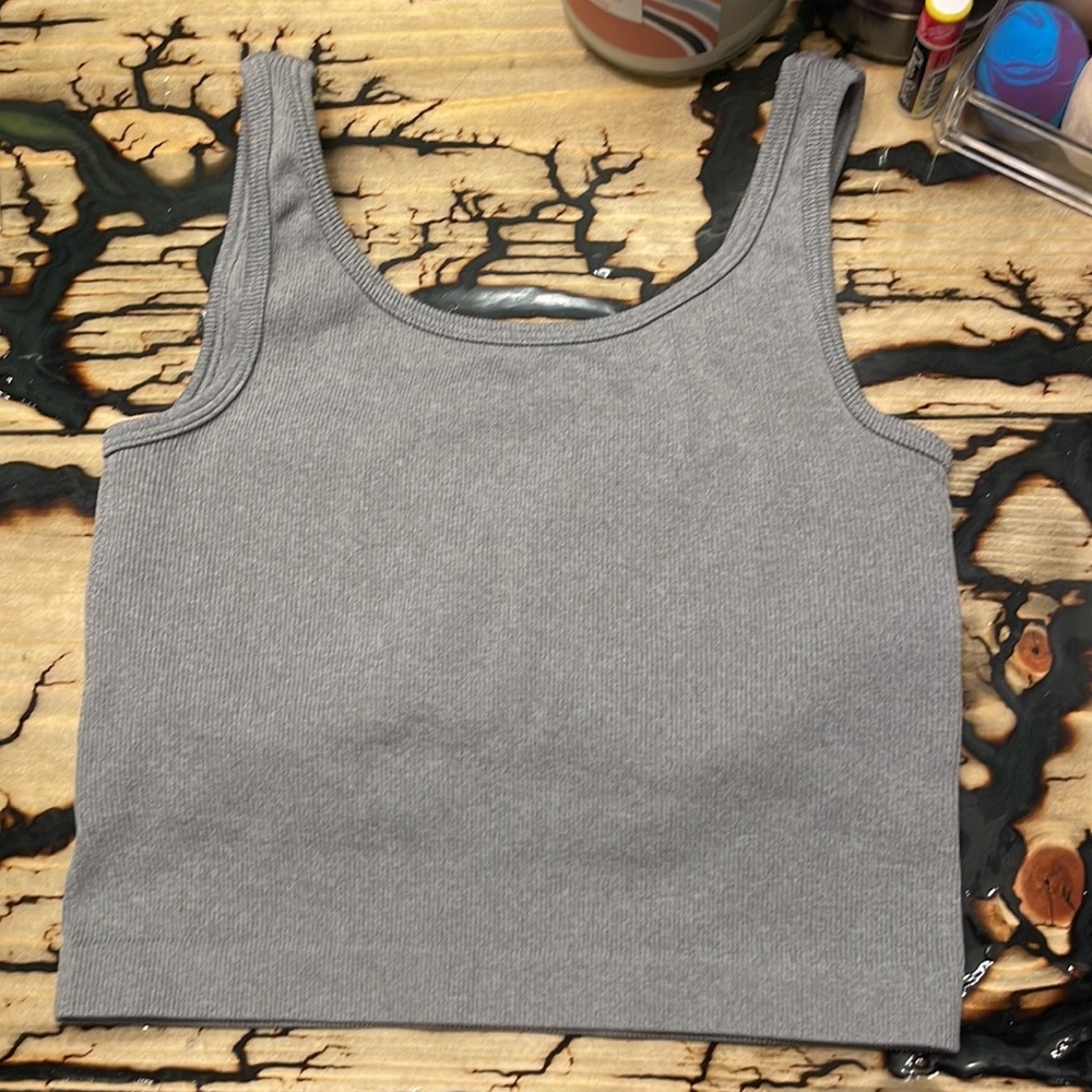 A Gray Pro-Fit crop top.